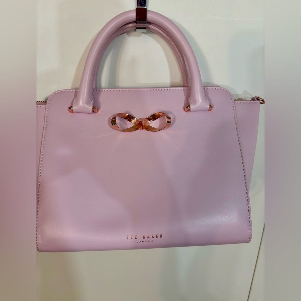 Ted Baker light pink hand bag with rose gold hardware. Purse has no flaws!
